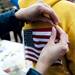 An American flag is pinned to a participant's sweatshirt on Saturday, April 20. AnnArbor.com I Daniel Brenner